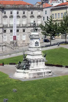 a monument in front of a building with a statue at HM - Infante Riverside Apartment R in Porto