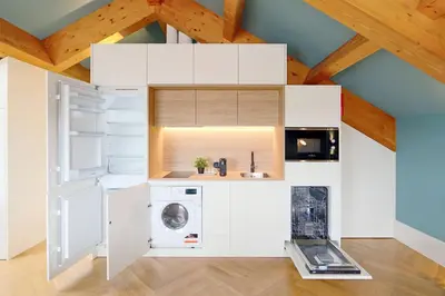 a kitchen with a washer and dryer in a room at HM - Infante Riverside Apartment R in Porto