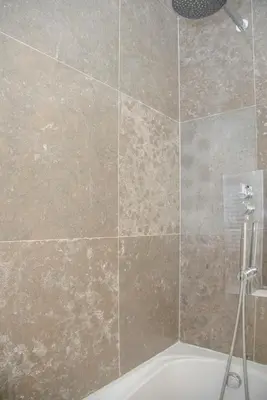a bathroom with a shower with a bath tub at Liiiving in Porto - Carlos Alberto Apartment in Porto