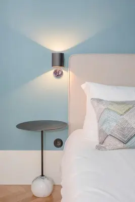 a bed with a side table next to a bed at Liiiving in Porto - Ribeira Design Apartment in Porto