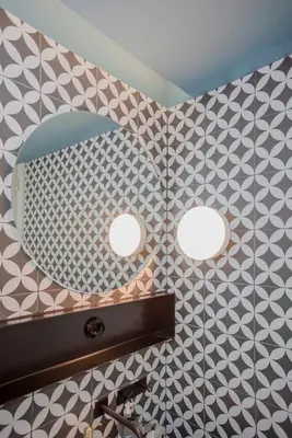 a bathroom with two lights and a mirror on the wall at Liiiving in Porto - Ribeira Design Apartment in Porto