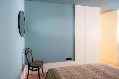 a bedroom with a bed and a chair at HM - Infante Riverside Apartment M in Porto
