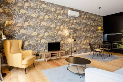 a living room with a wall with a mural of animals at BOUTIQUE Rentals-Art & Charm II Apt w/ Terrace in Porto
