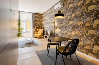 a dining room with a table and chairs and a wall mural at BOUTIQUE Rentals-Art & Charm II Apt w/ Terrace in Porto