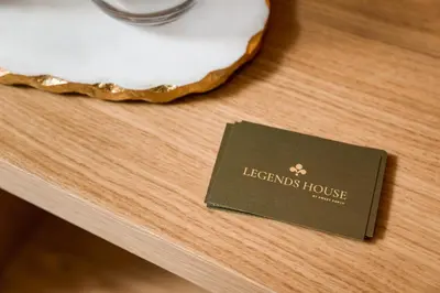 a card sitting on top of a table at Legends House by Sweet Porto in Porto