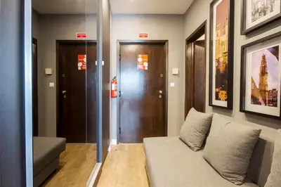 a living room with a couch and a door at 446 Galé Modern Apartment elevator,parking in Porto
