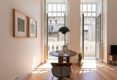 a dining room with a table and some windows at Tripas-Coração, Santa Catarina in Porto