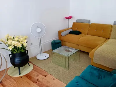 a living room with a couch and a table at Appartement Pont Luiz in Porto