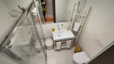 a white bathroom with a sink and a shower at Domus 21 - Batalha in Porto