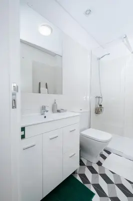 a white bathroom with a sink and a toilet at Oporto Shine in Porto