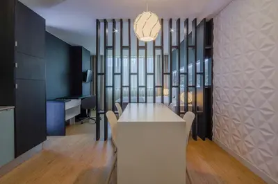 a dining room with a white table and chairs at 406 Galé Center Apartment wifi, parking in Porto
