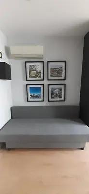 a bed in a room with three pictures on the wall at 404 Galé Center Apartment wifi, parking in Porto