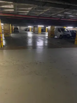 a parking lot with cars parked in a parking garage at 404 Galé Center Apartment wifi, parking in Porto