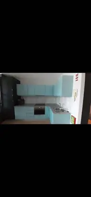a kitchen with blue cabinets and a sink at 404 Galé Center Apartment wifi, parking in Porto