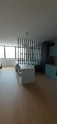 a living room with a table and a chair in it at 404 Galé Center Apartment wifi, parking in Porto