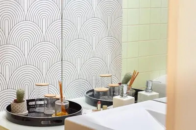 a bathroom with two sinks and a wall mural at Luxurious Townhome with River View by LovelyStay in Porto