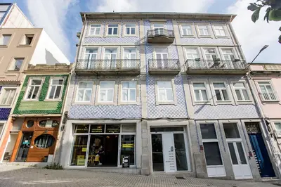 a blue and white building on a street at Bonjardim Studio w/ Balcony by LovelyStay in Porto