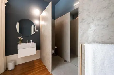 a bathroom with a sink and a mirror at Habitat137 in Porto