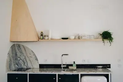 a kitchen with a sink and a counter top at Oxford Green House by LovelyStay in Porto