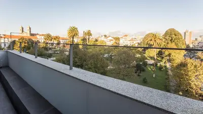 a balcony with a view of a city at Stylish Studio w/ AC & Balcony by LovelyStay in Porto
