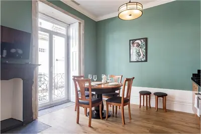 a dining room with a table and chairs at Artistic 2BR Flat Downtown w/ AC by LovelyStay in Porto