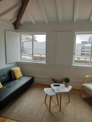a living room with a couch and a table at YOUR PLACE PORTO I in Porto