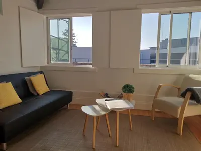 a living room with a couch and a table at YOUR PLACE PORTO I in Porto
