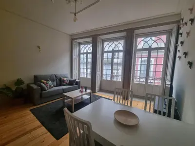 a living room with a table and a couch at Casa Burguesa Rua do Almada - Porto city center in Porto