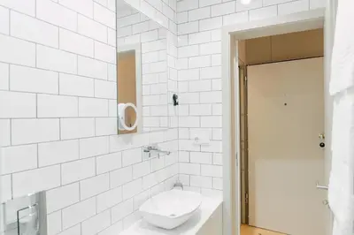 a white bathroom with a toilet and a sink at Casa Burguesa Rua do Almada - Porto city center in Porto