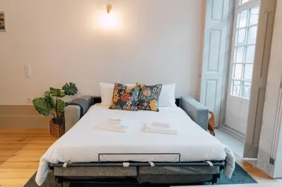 a bedroom with a bed in a room at Casa Burguesa Rua do Almada - Porto city center in Porto