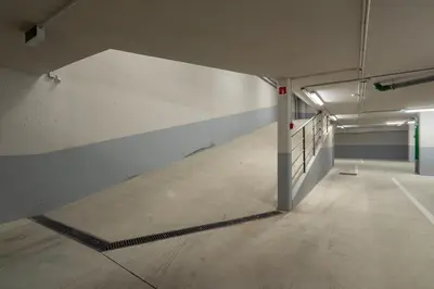 an empty hallway in a parking garage with a tunnel at Habitatio - Bom Sucesso by LuxiStay in Porto