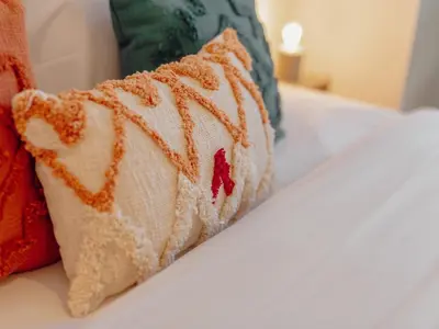 a close up of a pillow on a bed at OPORTO GUEST Poveiros Home in Porto