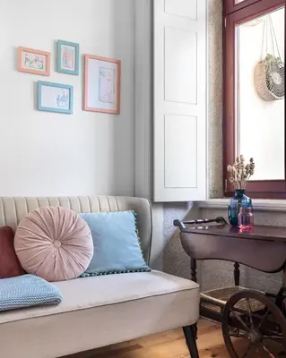 a living room with a couch and a table at Vibrant flat by São Bento w/balcony - Loureiro140 in Porto