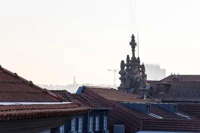 a view of roofs of buildings in a city at City Center 2BR Flat w/ AC by LovelyStay in Porto