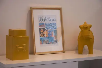 a shelf with a picture and a vase on a table at North Star Flats @Santa Marinha in Vila Nova de Gaia