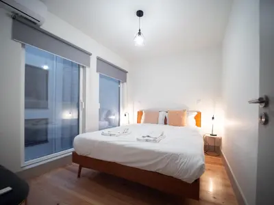 a bathroom with a sink and a toilet and a shower at Oporto City View- Trindade Lovely in Porto