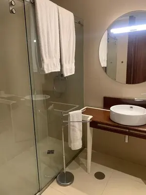 a bathroom with a shower and a sink and a mirror at Oporto Chic & Cozy - Oliveiras in Porto