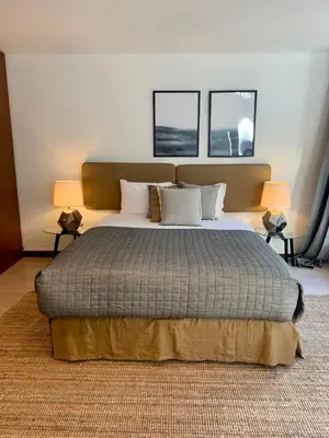 a bedroom with a large bed with two windows at Oporto Chic & Cozy - Oliveiras in Porto