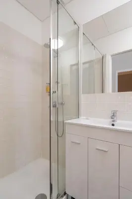 a bathroom with a shower and a sink at Habitatio - Aliados by LuxiStay in Porto