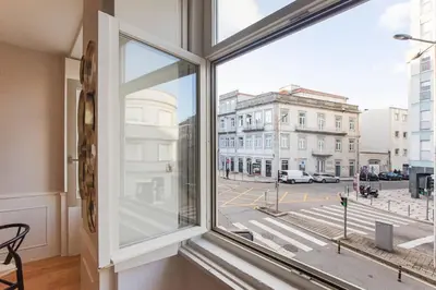 a window with a view of a city street at Cute & Bright Flat w/ AC by LovelyStay in Porto