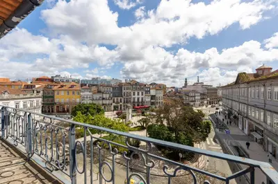 a view of a city from a balcony at CLUBE Charming Apartments - Cedofeita in Porto
