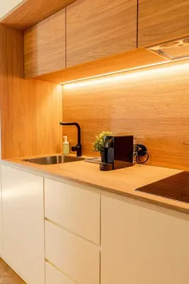 a kitchen with a sink and a counter top at Award Winning Design Apt City Center - River View by lisbeyond in Porto