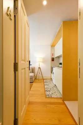 an open door to a kitchen with a living room at Oporto Blue República - Cozy City Centre Studio in Porto