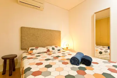a bedroom with a bed with blue towels on it at Oporto Blue República - Cozy City Centre Studio in Porto