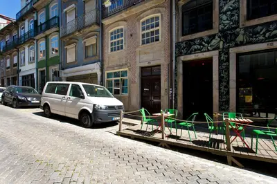 a white van parked on the side of a street at Oporto Blue República - Cozy City Centre Studio in Porto