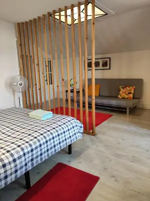 a living room with a bed and a couch at Oporto Blue Liberdade - Central Studio with Amazing View and Kitchenette in Porto