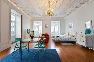 a living room with a table and chairs at Oporto Blue Aliados - Historic City Center Studio in Porto