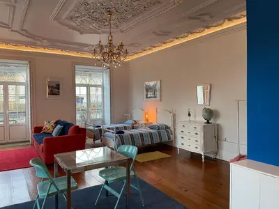 a living room with a couch and a table at Oporto Blue Aliados - Historic City Center Studio in Porto