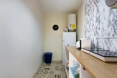 a kitchen with a counter and a refrigerator at Oporto Blue Cedofeita - Charming Citycenter Loft in Porto