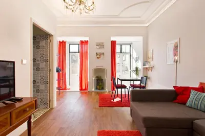 a living room with a couch and a table at Oporto Blue Cedofeita - Charming Citycenter Loft in Porto